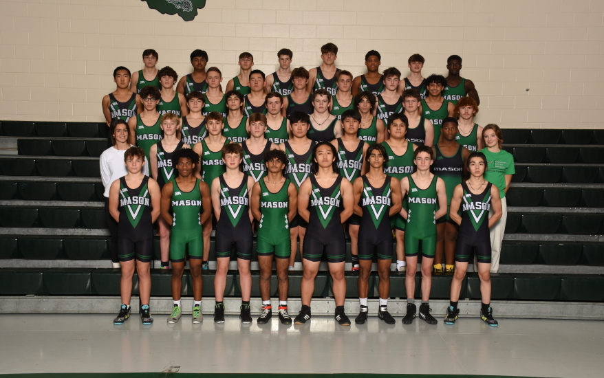 boys wrestling team photo on bleacher